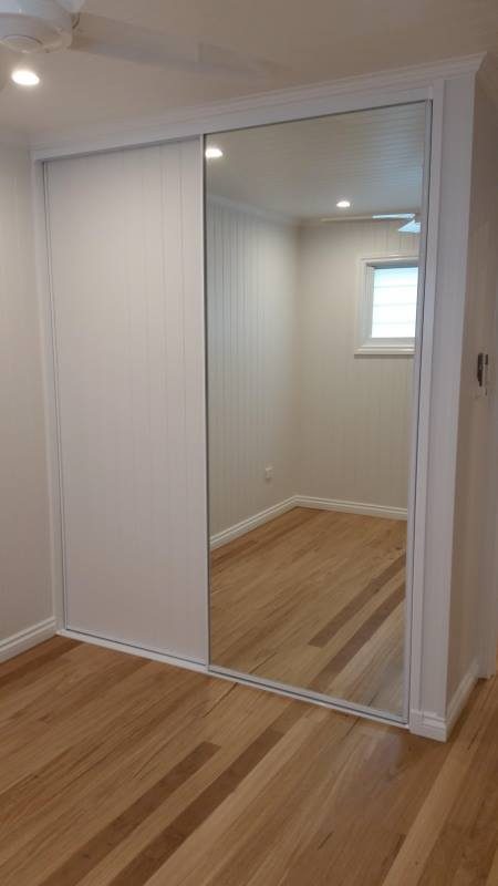 DIY Framed Sliding Wardrobe doors with white vinyl and mirror inserts